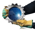 Gloved Hands Holding a Metallic Cogwheel with a Solar Panel Inside