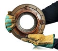 Gloved Hands Holding a Rusty Iron Porthole with a Copy Space - Generative Ai