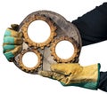 Gloved Hands Holding a Section of Tree Trunk with a Wooden Gears
