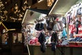 Gloves and hats on christmas market booth in merano south tyrol during night