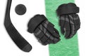 Gloves, hockey stick and hockey puck on a white background with a green stripe. Concept, hockey, background