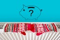 Piggy bank on home heating radiator. Energy crisis and expensive heating costs for winter season.