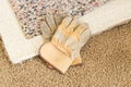 Gloves On Pulled Back Carpet and Pad In Room Royalty Free Stock Photo