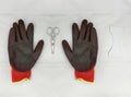 Gloves and scissors, work tools, white background. Black and red colors Royalty Free Stock Photo