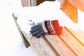 gloves on a wooden bench on a cold winter day