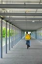 Glovo delivery biker in urban contest