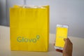Glovo food delivery service, mobile app and bag.