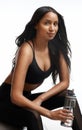 The glow of good health is so amazing. Studio portrait of a sporty young woman holding a water bottle against a white Royalty Free Stock Photo