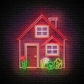 Glow House with Red Roof and Flowerbed Royalty Free Stock Photo