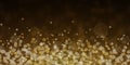 Glow light effect. Gold glitter particles background. Royalty Free Stock Photo