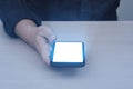 Glow lighting of phone in hands of guy. Close up of hand holding smart phone blank screen with glowing light effect. Royalty Free Stock Photo