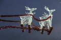 Glowed Santas deers on night sky background Royalty Free Stock Photo