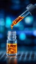 A glowing amber liquid dripping from a pipette into a small glass vial in a laboratory setting Royalty Free Stock Photo