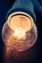 Glowing antique filament light bulb
