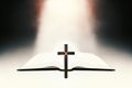 Glowing bible and bright beams of light and holy jesus cross Royalty Free Stock Photo