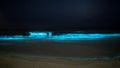 Glowing bioluminescent beach Royalty Free Stock Photo