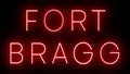 Glowing and blinking red retro neon sign for FORT BRAGG