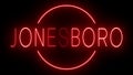 Glowing and blinking red retro neon sign for JONESBORO