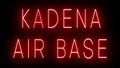 Glowing and blinking red retro neon sign for KADENA AIR BASE