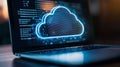 Close up of glowing blue cloud icon on laptop screen concept of cloud computing data storage network technology Royalty Free Stock Photo