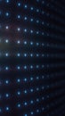 Glowing blue LED dot grid fading into darkness, minimal futuristic technology background with depth perspective Royalty Free Stock Photo