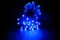 Glowing blue led pixels christmas holiday lights on black background Royalty Free Stock Photo