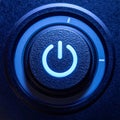 Glowing Blue Power Button Activated on a Device Royalty Free Stock Photo