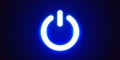 Glowing blue power button symbol on a dark background. Concept of technology, energy, and control. Royalty Free Stock Photo