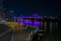 Glowing bridge in cityscape in night time