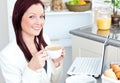 Glowing businesswoman drinking coffee and smiling Royalty Free Stock Photo