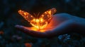 A glowing butterfly rests gently on a hand at night Royalty Free Stock Photo