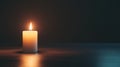 glowing candle illuminates dark, minimal background, creating serene atmosphere