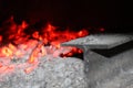 Glowing carbon in wooden stove