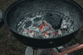 Glowing charcoal with bright hotspot on grill Royalty Free Stock Photo