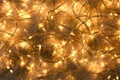 Glowing Christmas lights on wooden background, top view Royalty Free Stock Photo