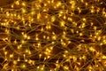 Glowing Christmas lights on wooden background Royalty Free Stock Photo