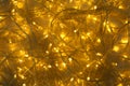 Glowing Christmas lights on  wooden background, top view Royalty Free Stock Photo