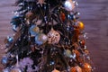 Glowing Christmas tree in dark at night. Christmas tree decorated with toys and balls. Closeup view of beautiful decorated Christm Royalty Free Stock Photo