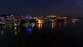 Glowing cityscape at Udaipur by night. The majestic city palace reflecting lights on Lake Pichola, travel destination in Rajasthan Royalty Free Stock Photo