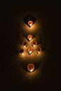 Glowing clay lamp in dark night - Happy Diwali, Light festival, Illuminated lights concept