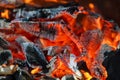 Glowing coals in a barbeque coal fire smoke Royalty Free Stock Photo