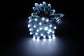 Glowing cold white led pixels christmas holiday lights on black background Royalty Free Stock Photo