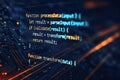 Glowing computer code displayed on a dark background with circuit board patterns and orange light streaks Royalty Free Stock Photo