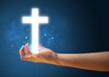 Glowing Cross In The Hand Of A Woman