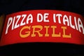 Glowing in the dark inscription of food service Pizza from Italy grill. Editorial Use Only