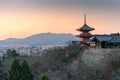 Glowing December sky during sunset over Kyoto city and pagoda of Kiyomizu-dera temple. Famous Buddhist temple in front of the Royalty Free Stock Photo