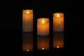 Glowing decorative LED candles on black Royalty Free Stock Photo