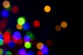 Glowing defocused colorful Christmas garland on black background. Border design Garland colourful lights Royalty Free Stock Photo