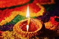 Rangoli with glowing diya