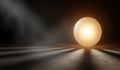 Glowing egg illuminated by dramatic spotlight in dark setting Royalty Free Stock Photo